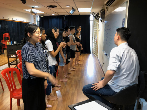 Dominic teaching group singing